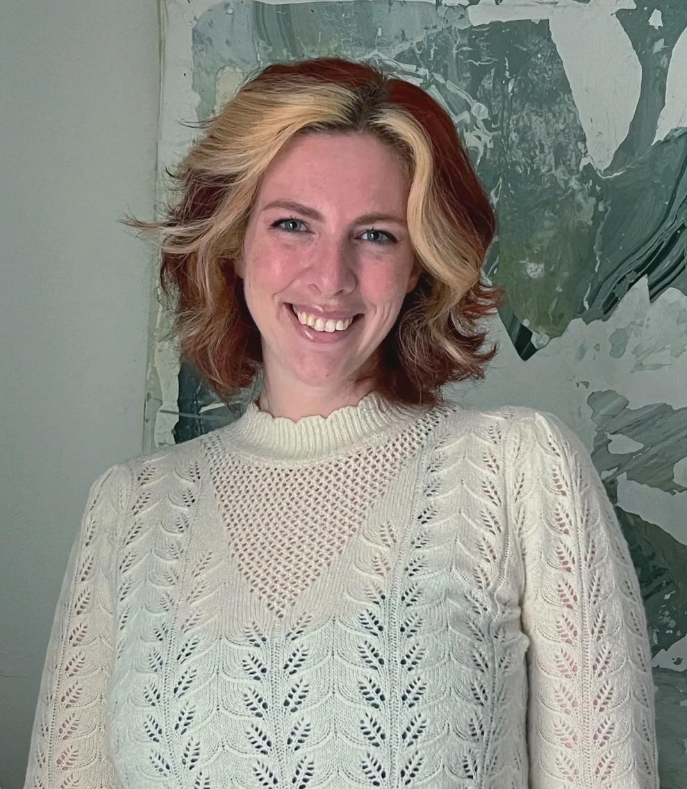 April Ruback, photographed in front of one of her prints.