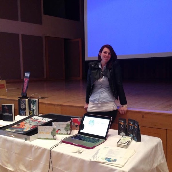 April at her senior show table of web and print work